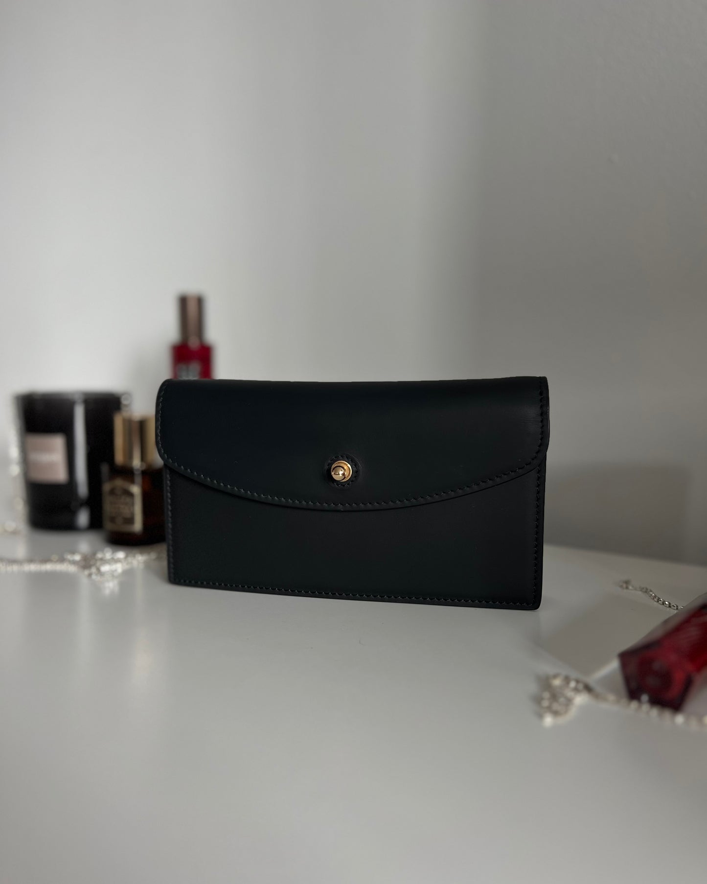 Black Leather Crossbody Bag with Gold Clasp