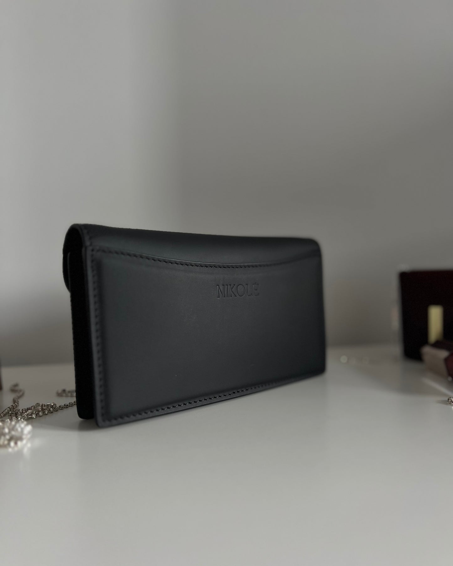 Black Leather Crossbody Bag with Gold Clasp