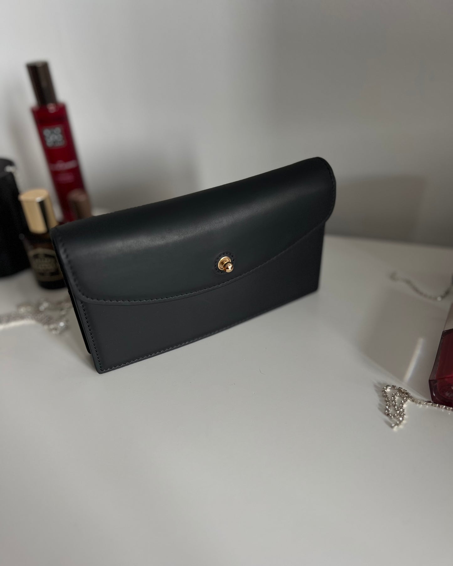 Black Leather Crossbody Bag with Gold Clasp