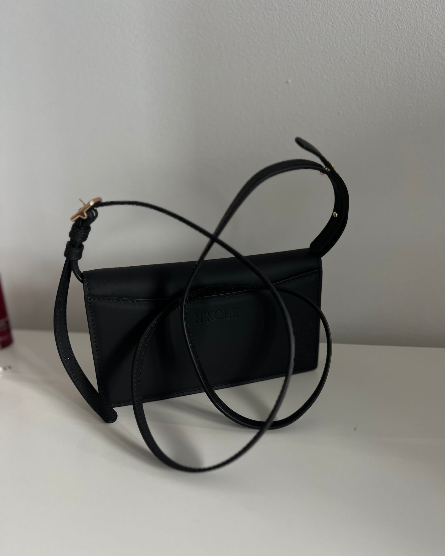 Black Leather Crossbody Bag with Gold Clasp