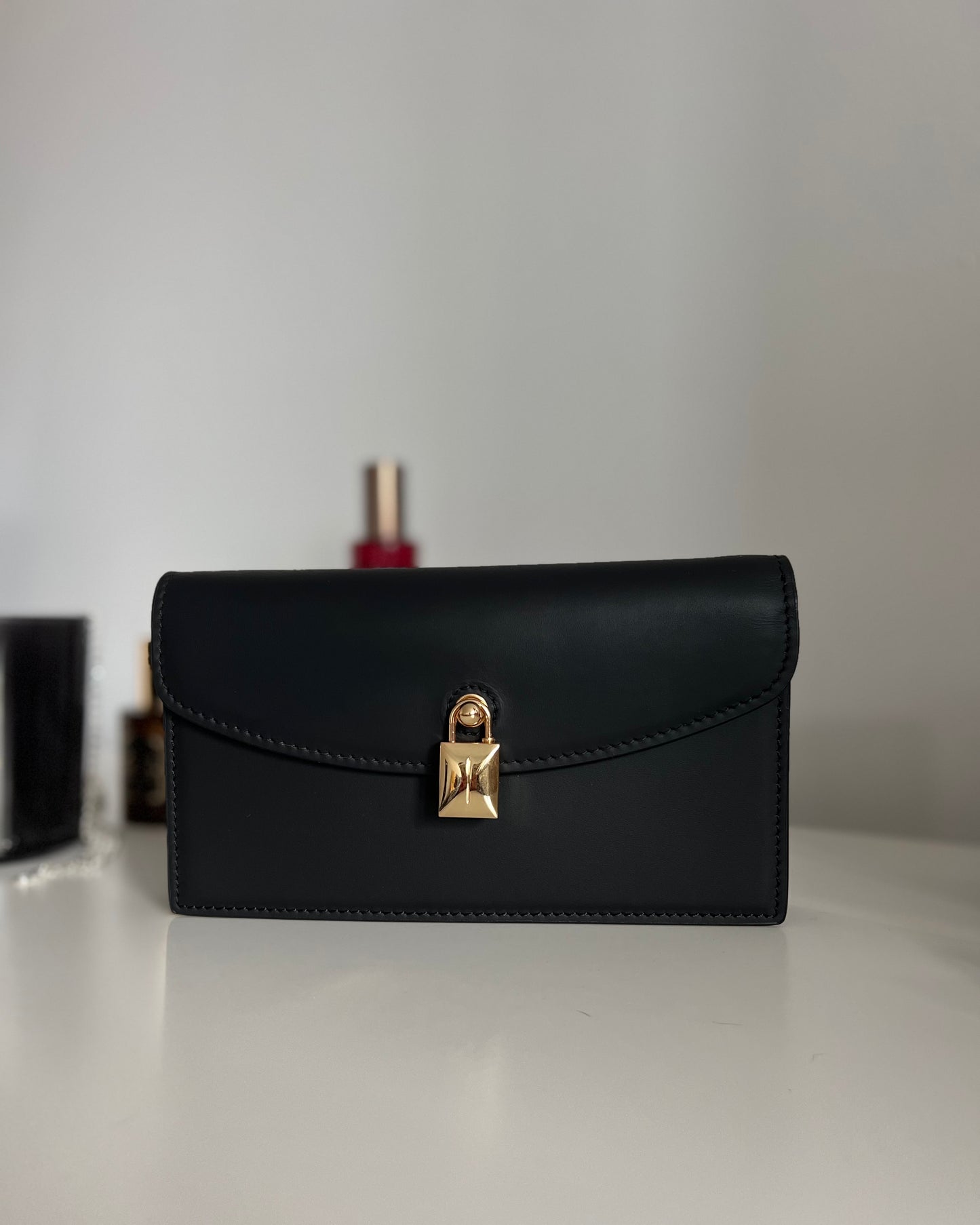 Black Leather Crossbody Bag with Gold Clasp