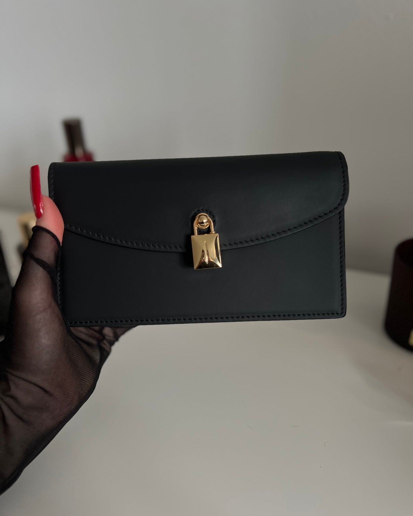 Black Leather Crossbody Bag with Gold Clasp