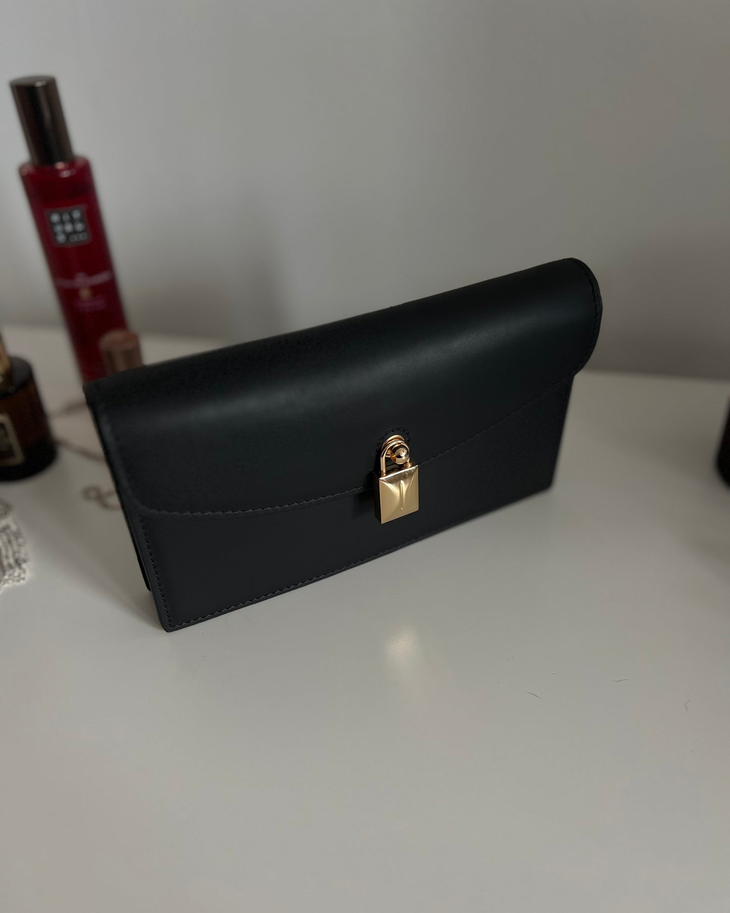 Black Leather Crossbody Bag with Gold Clasp